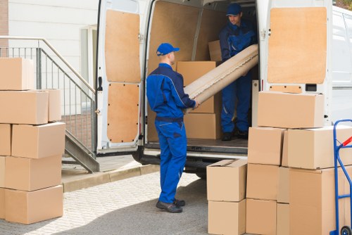 Removal van and packed boxes prepared for a house move in Earls Court
