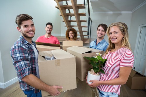 Furniture being carefully loaded into a moving van
