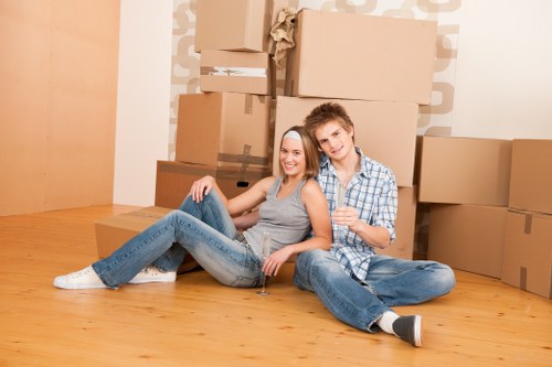 Removal team handling fragile household items during a local move