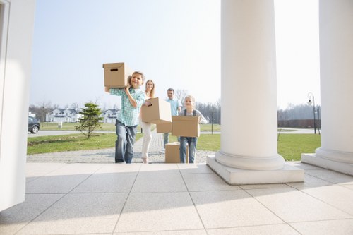 Movers preparing a safe van loading process in Earls Court