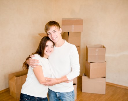 Packed moving boxes and furniture ready for transport in West London