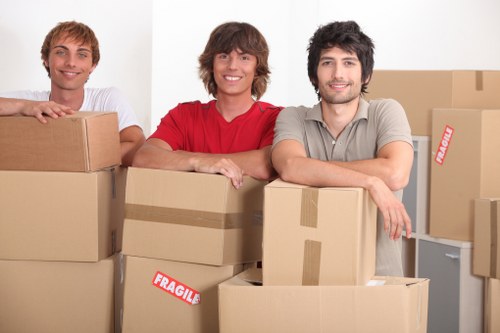Trained moving staff handling belongings carefully during transport