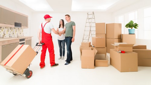 Loading household furniture into a moving truck in Earls Court