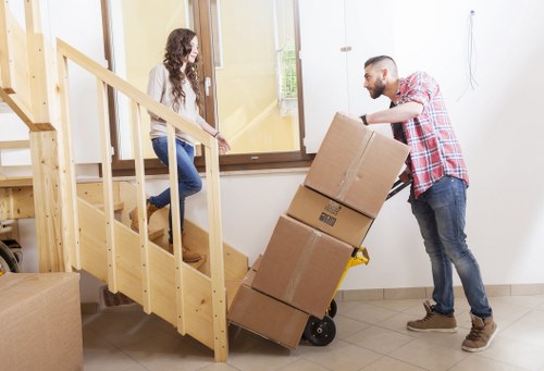 Packed boxes and furniture prepared for loading in Earls Court