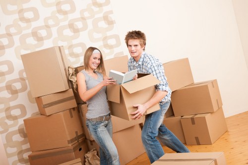 Packed office furniture and equipment ready for a local business move